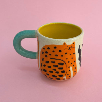 Taza gatos naranjas